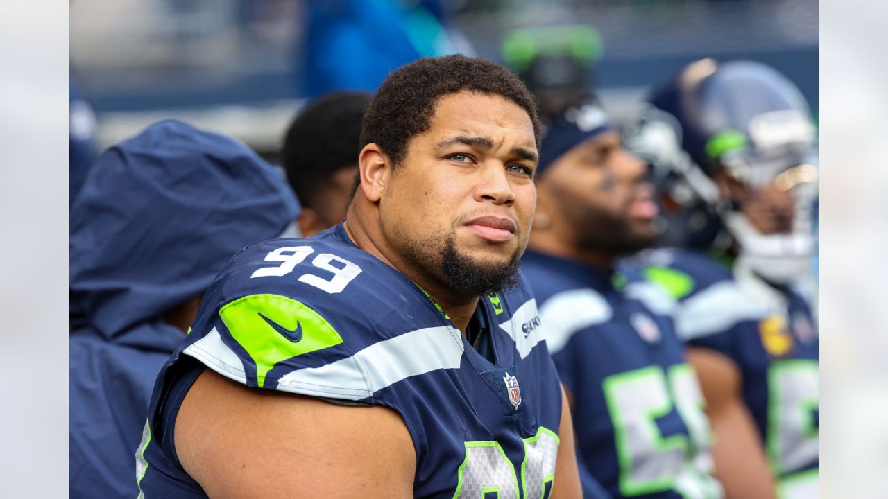 Seattle Seahawks defensive tackle Al Woods (99) reacts after a