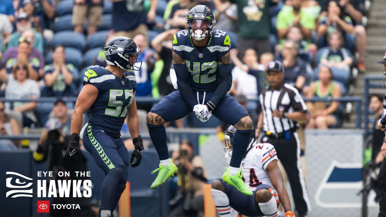 Seattle Seahawks guard Damien Lewis, left, celebrates with head