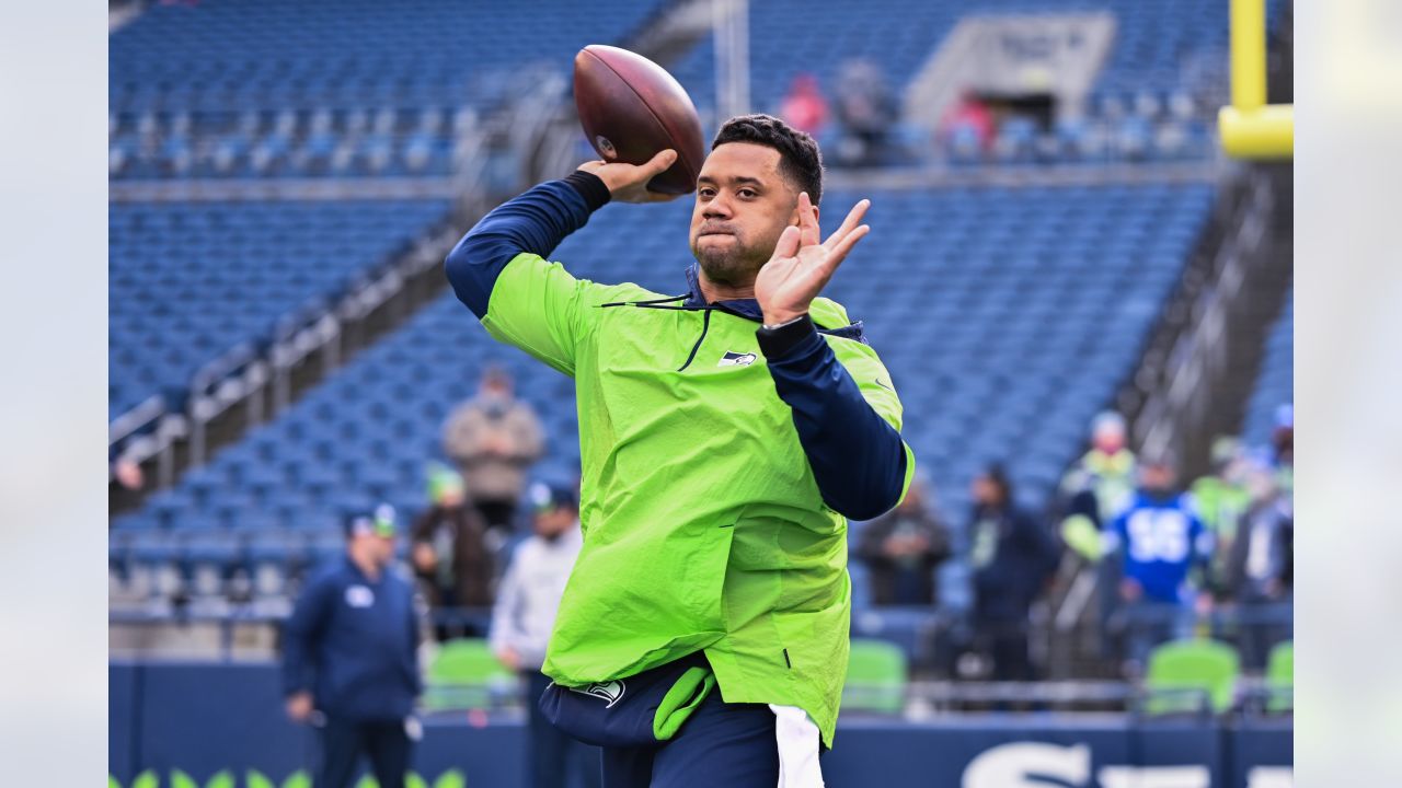 Seattle Seahawks wide receiver Dee Eskridge signs autographs following the  NFL football team's mock game Friday, Aug. 4, 2023, in Seattle. Eskridge  was suspended Friday for the first six games of the