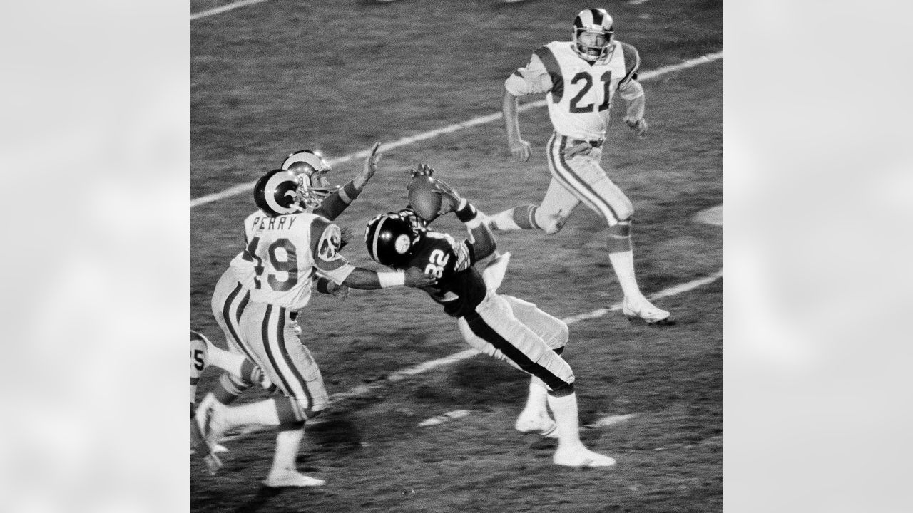 Los Angeles Rams running back Wendell Tyler (26) is thrown for four-yard  loss by Pittsburgh Steelers linebacker Jack Lambert (58) during first  quarter of Super Bowl XIV at the Rose Bowl, Jan.