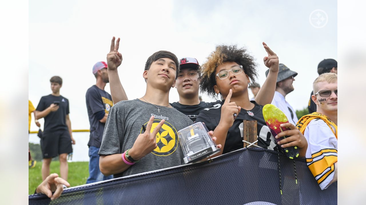 A young Pittsburgh Steelers fan poses for a photo with Pittsburgh Steelers  mascot Steely McBeam during Back Together Weekend at the NFL football  team's training camp at St. Vincent's College in Latrobe