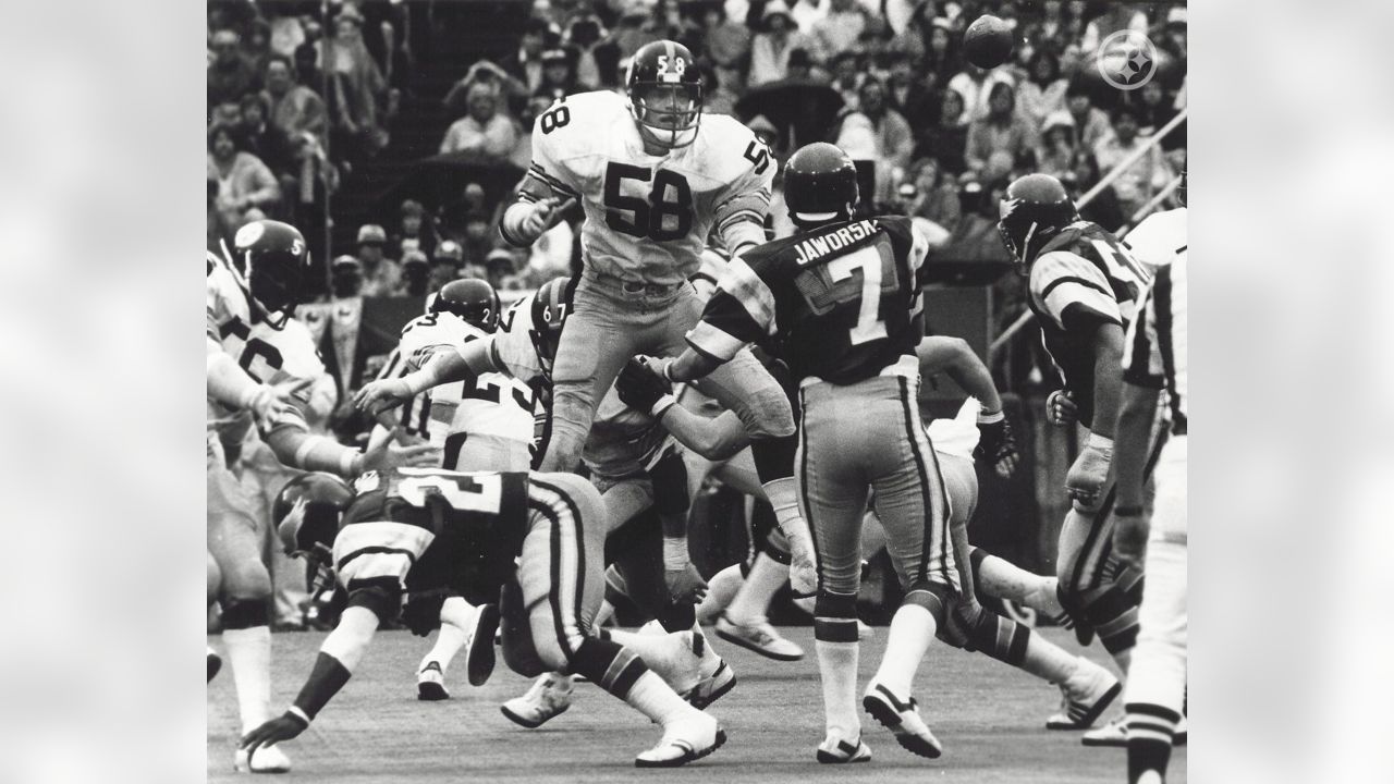 Steelers linebacker Jack Ham watches as a trainer untapes his shoes in  Pittsburgh on Sunday, Dec. 23, 1974 after 32-14 win over the Buffalo Bills.  Ham recovered a second quarter fumble, the