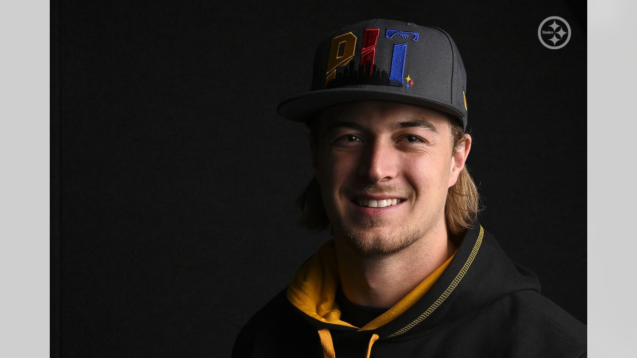 Quarterback Kenny Pickett, the Pittsburgh Steelers first-round draft pick,  poses with a jersey after meeting with reporters at the team's training  facility in Pittsburgh, Friday, April 29, 2022. (AP Photo/Gene J. Puskar