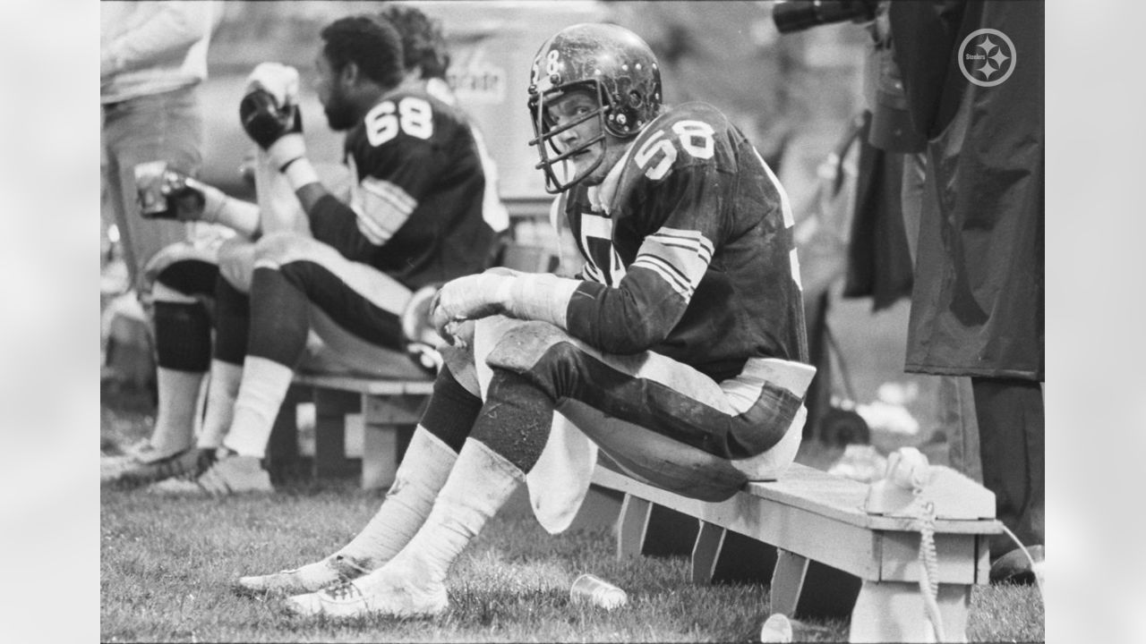 Steelers linebacker Jack Ham watches as a trainer untapes his shoes in  Pittsburgh on Sunday, Dec. 23, 1974 after 32-14 win over the Buffalo Bills.  Ham recovered a second quarter fumble, the