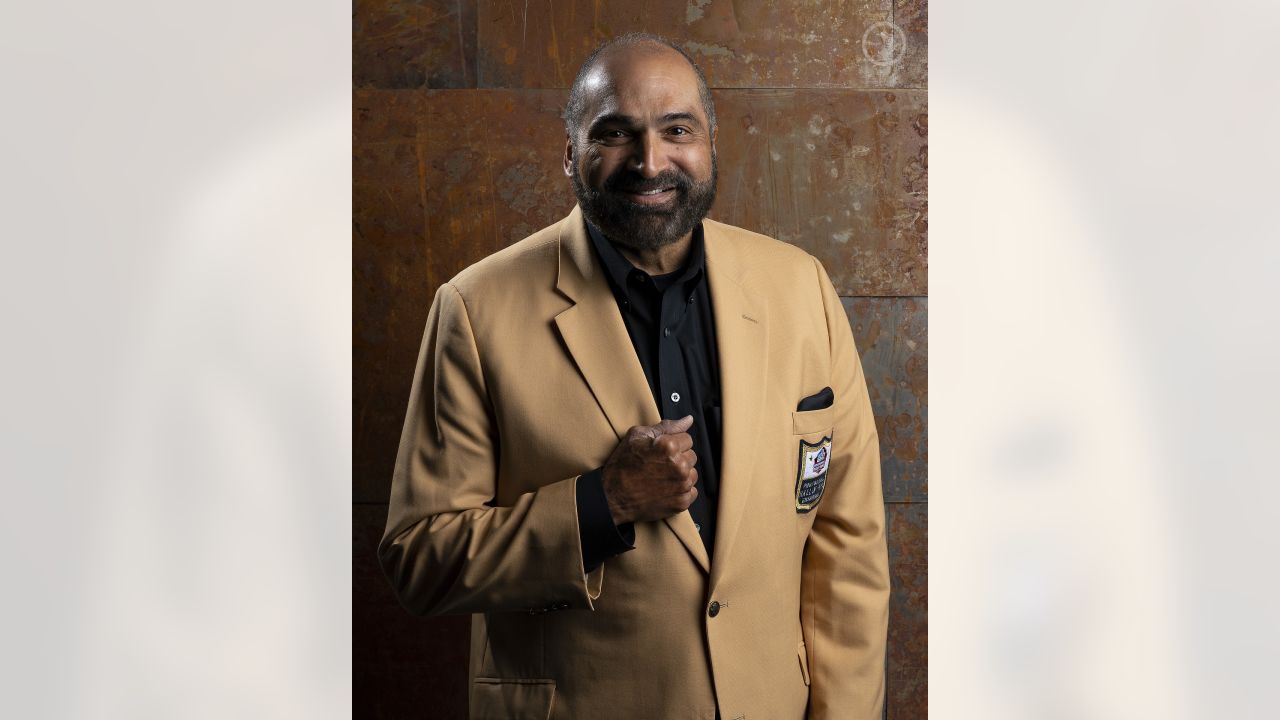 Casual portrait of Pittsburgh Steelers Franco Harris with wife and