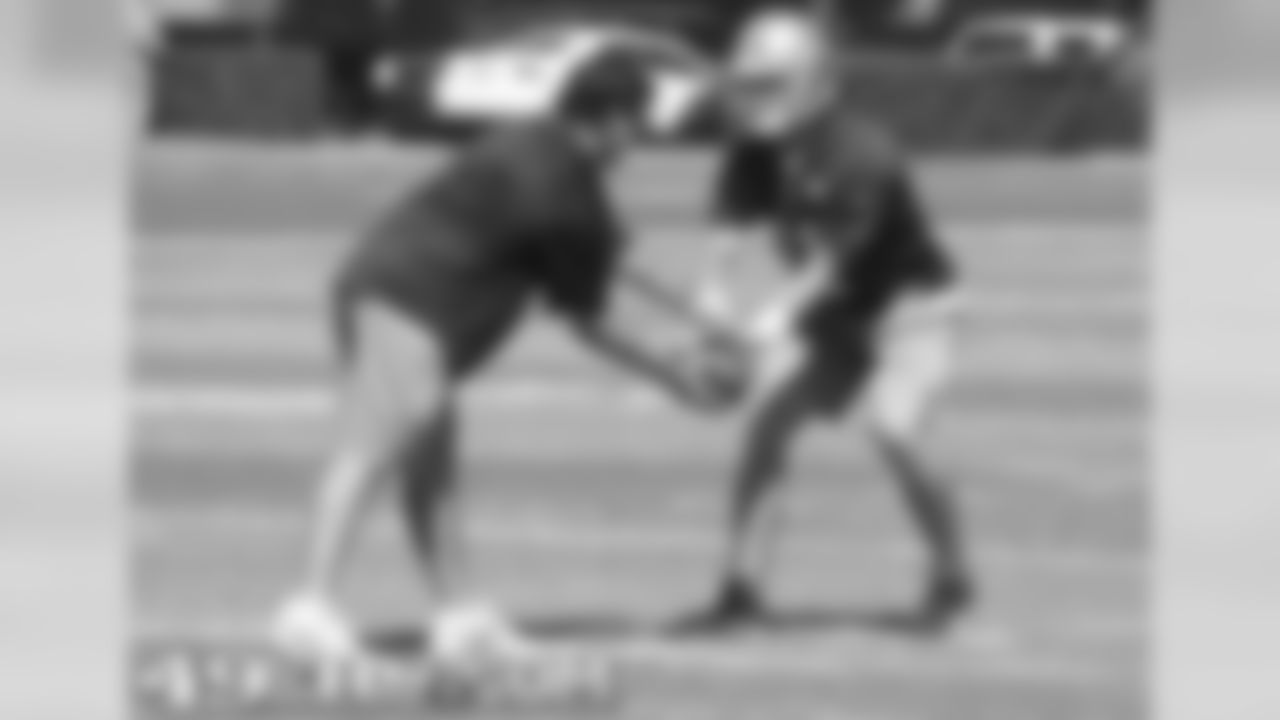 Offensive assistant Jason Michael and QB Alex Smith