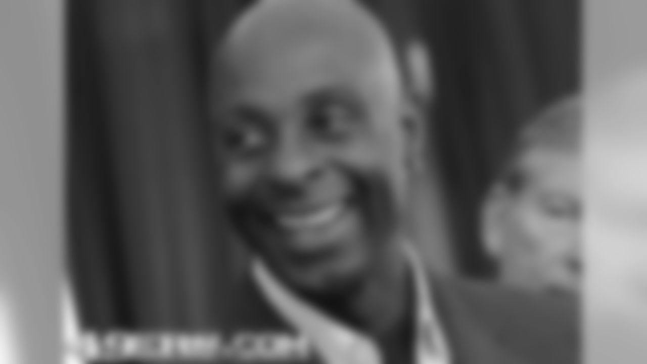 Jerry Rice smiles during the media session