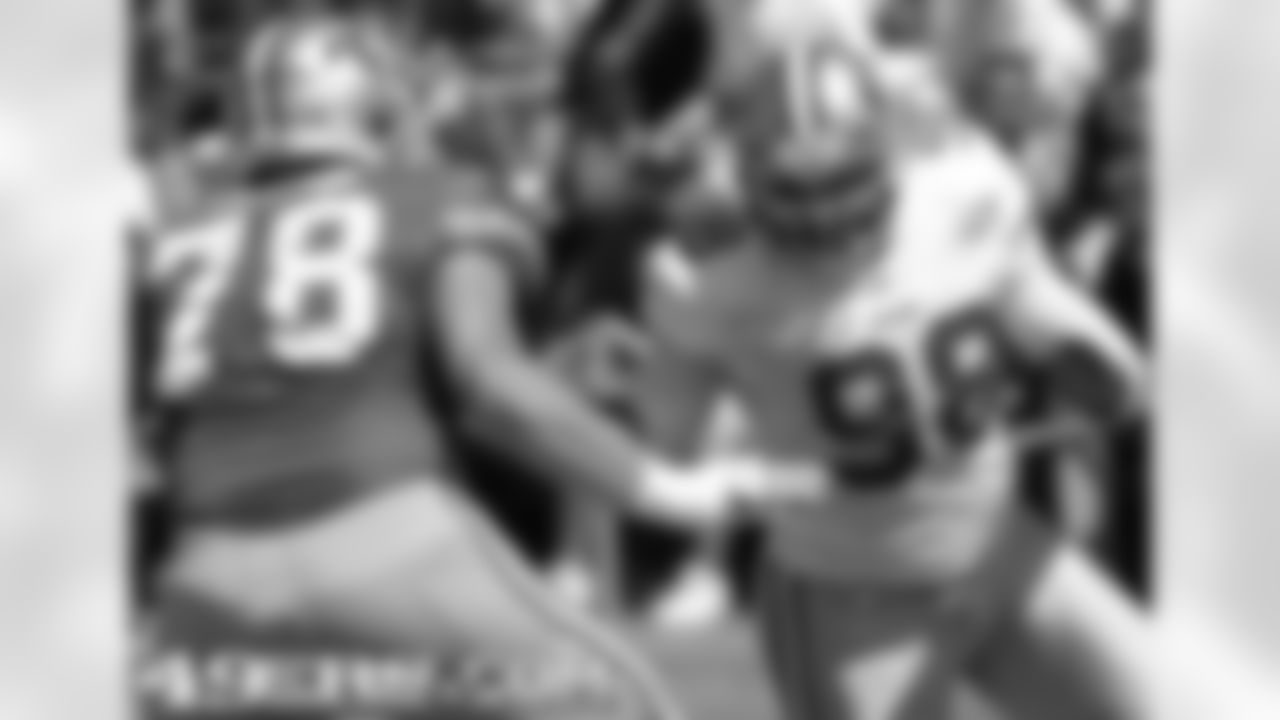 G Mike Person and LB Parys Haralson