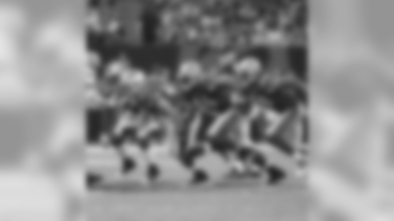 Michael Robinson, Zak Keasey, Delanie Walker and Dashon Goldson attack the