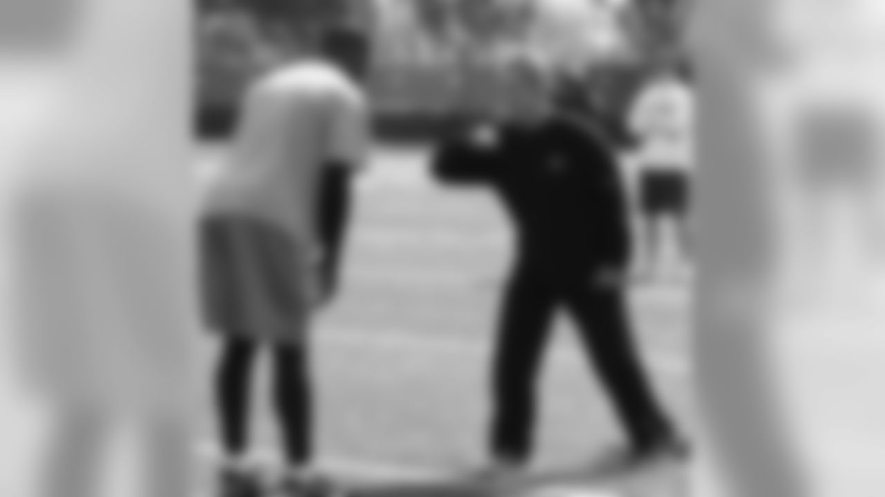 Coach Jerry Sullivan gives some pointers to Bryant Johnson