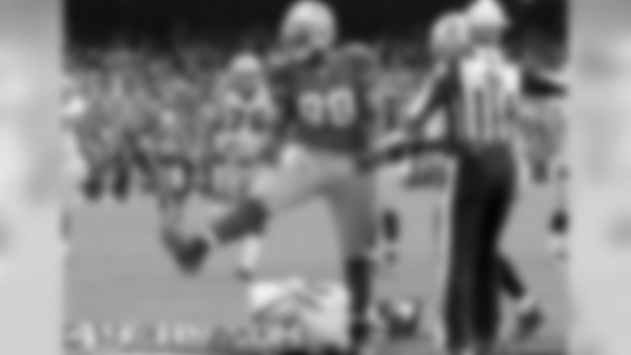 LB Parys Haralson celebrates a sack vs. Oakland