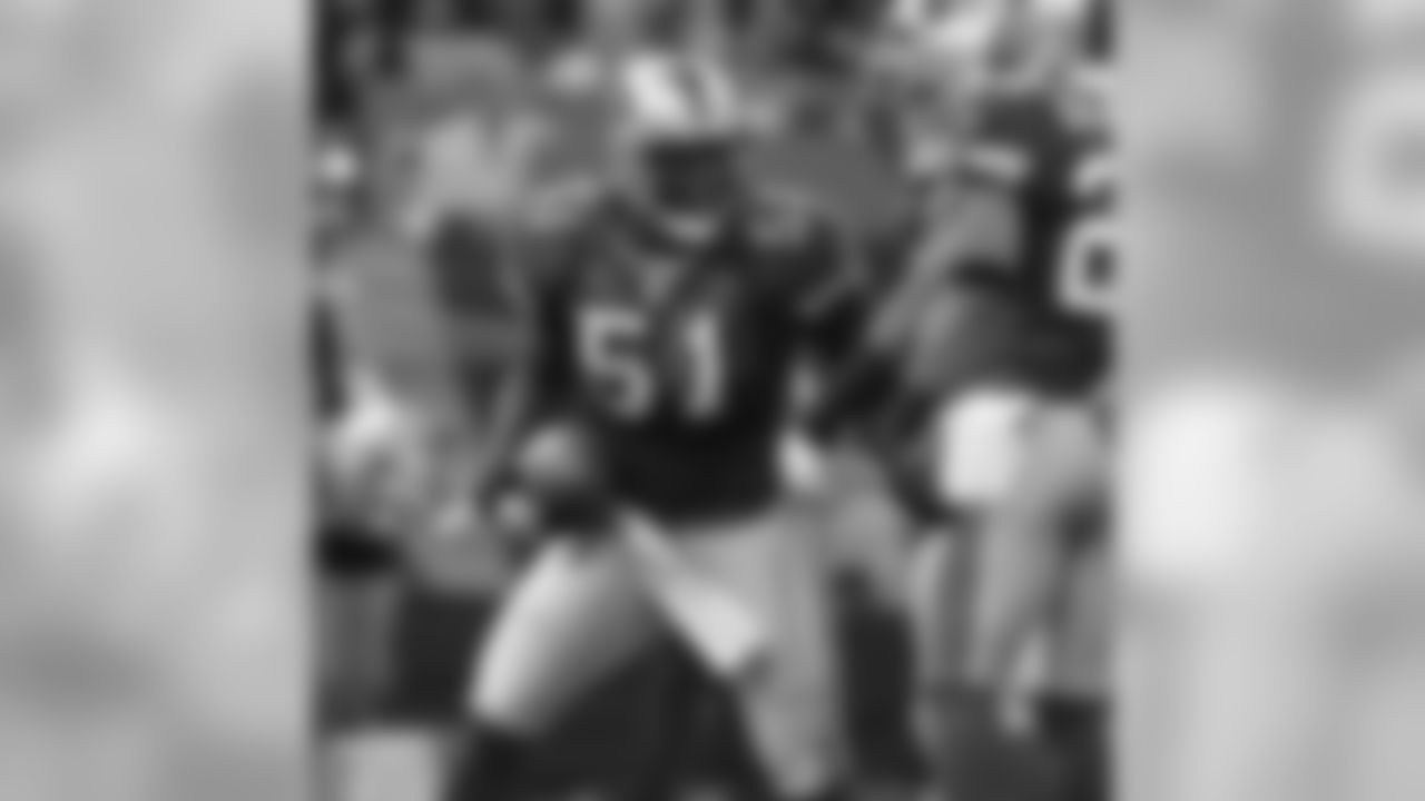 Takeo Spikes celebrates his interception