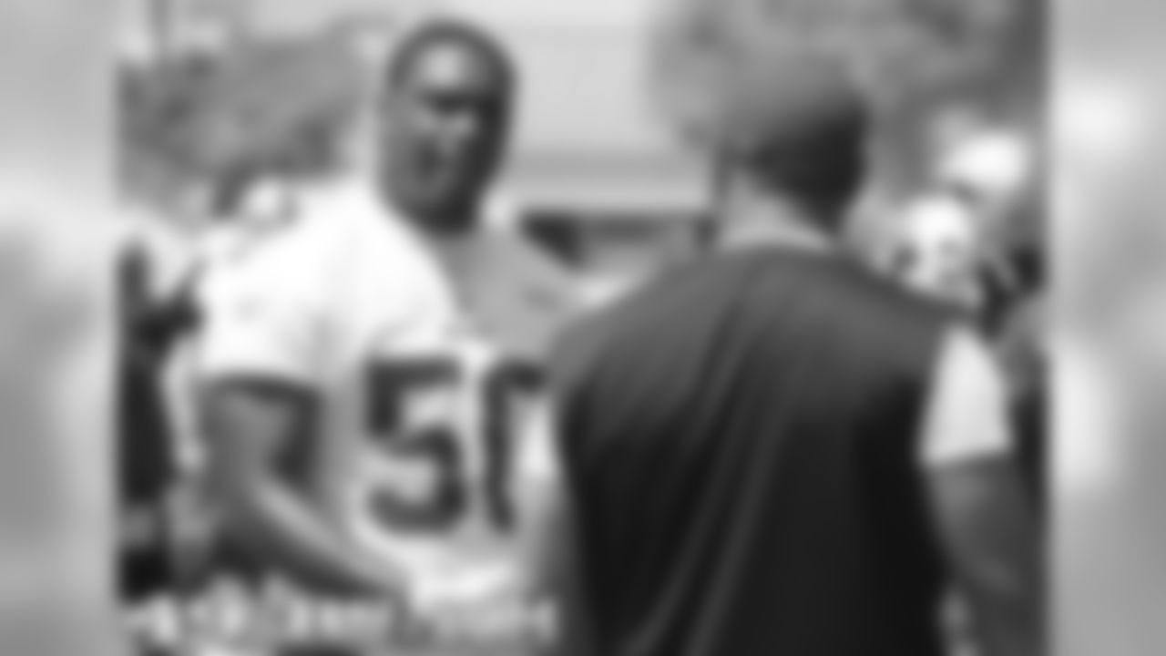 LB Diyral Briggs and defensive coordinator Greg Manusky
