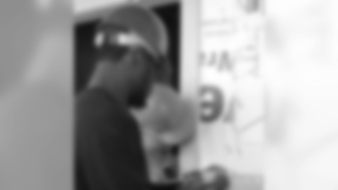 CB Marcus Hudson works on the entry way at a Habitat for Humanity house bui