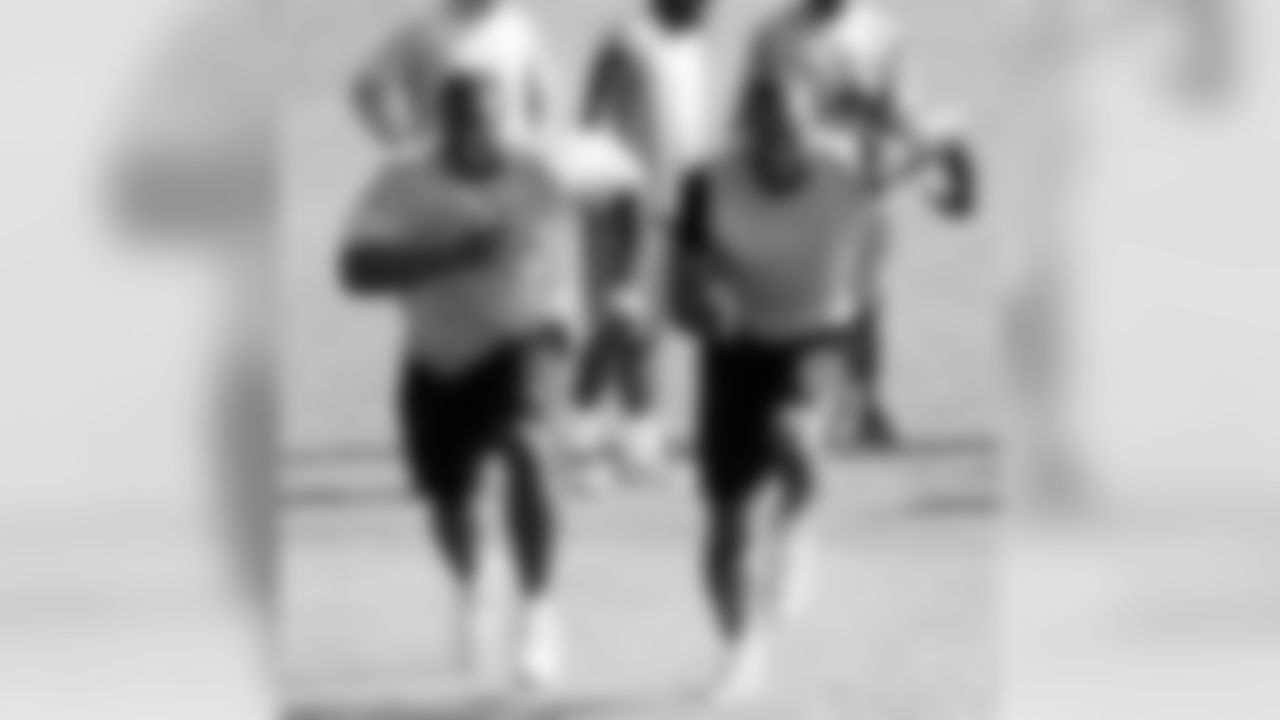 LBs Brandon Moore and Manny Lawson