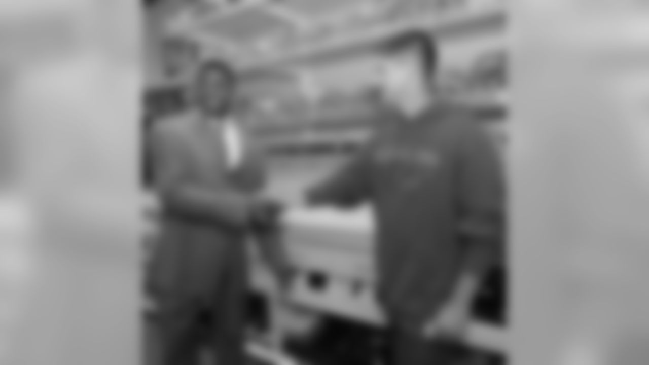 Michael Crabtree with 49ers equipment manager Steve Urbaniak
