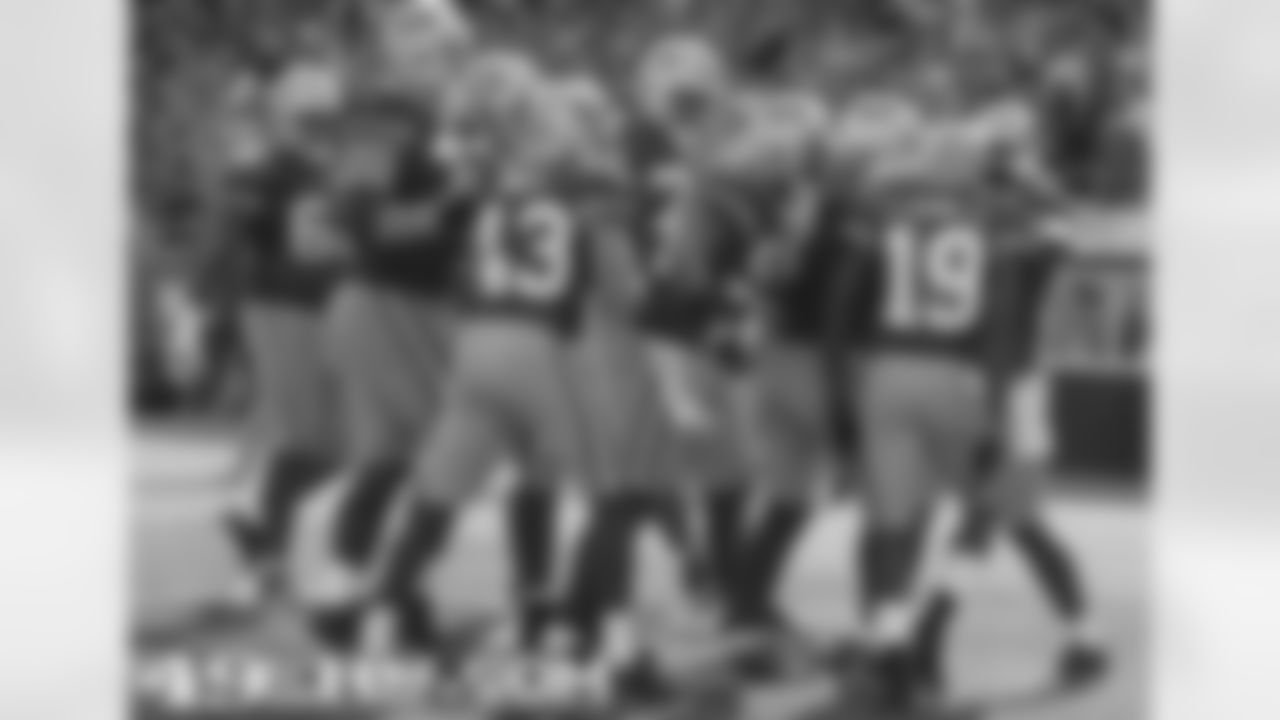 WR Ted Ginn Jr. is mobbed by his teammates