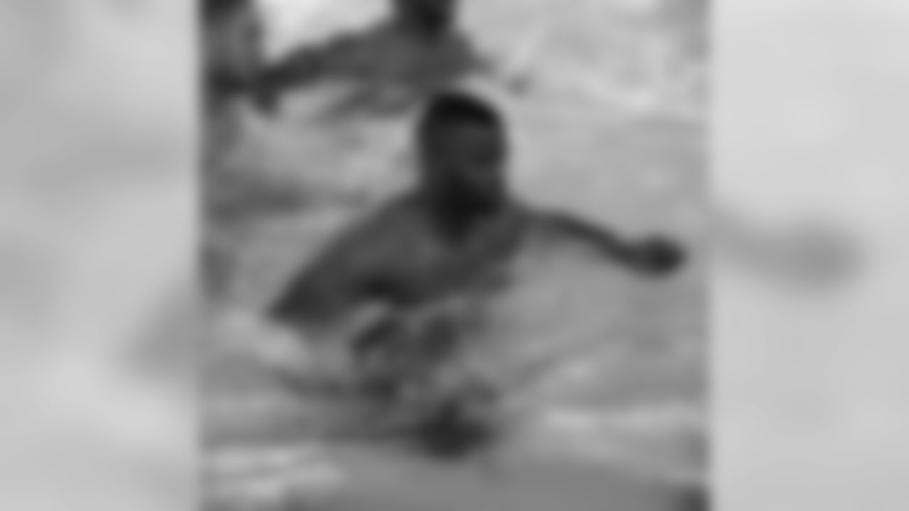 LB Brandon Moore does high knees across the pool