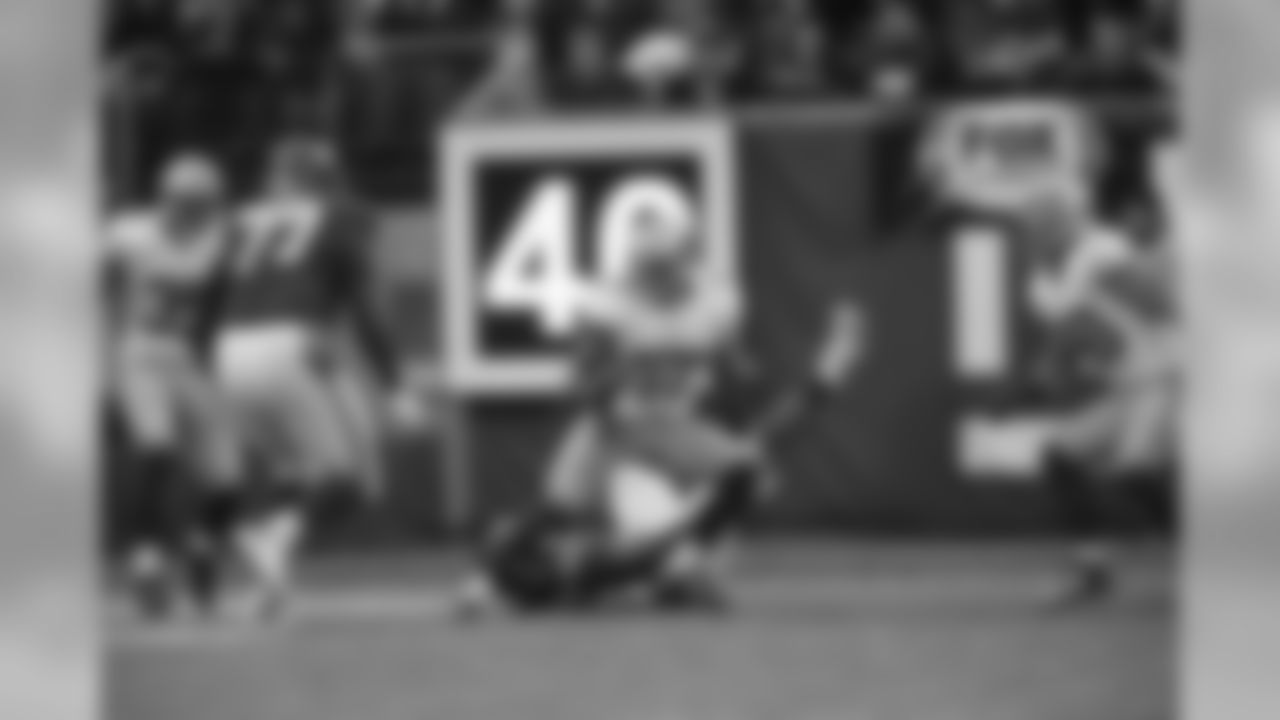 Covering a wide receiver in the flat, Michael Wilhoite hauls in an Eli Manning pass to stop the Giants in the red zone.
