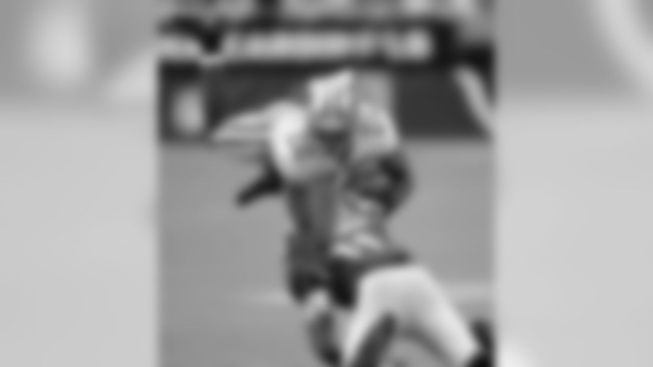 2009 -- 49ers cornerack Nate Clements and Cardinals wide receiver Larry Fitzgerald.