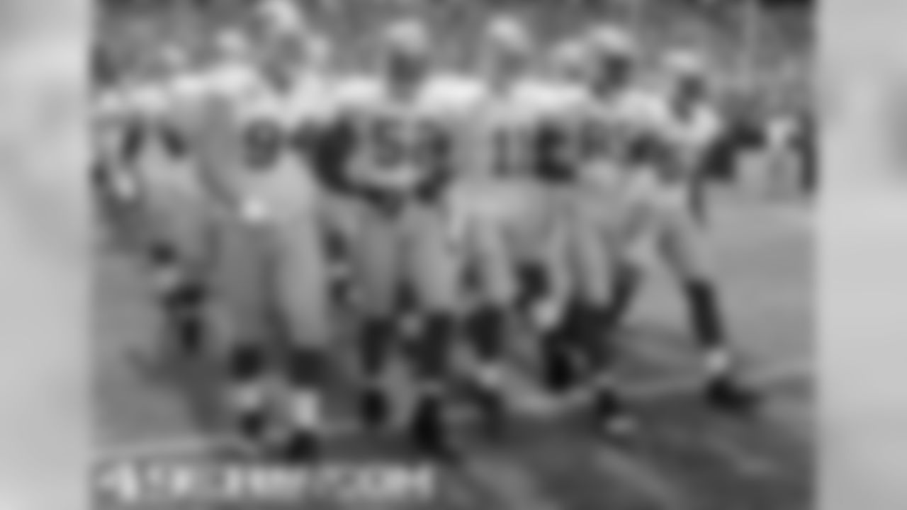 Captains lead the team onto the field in Seattle