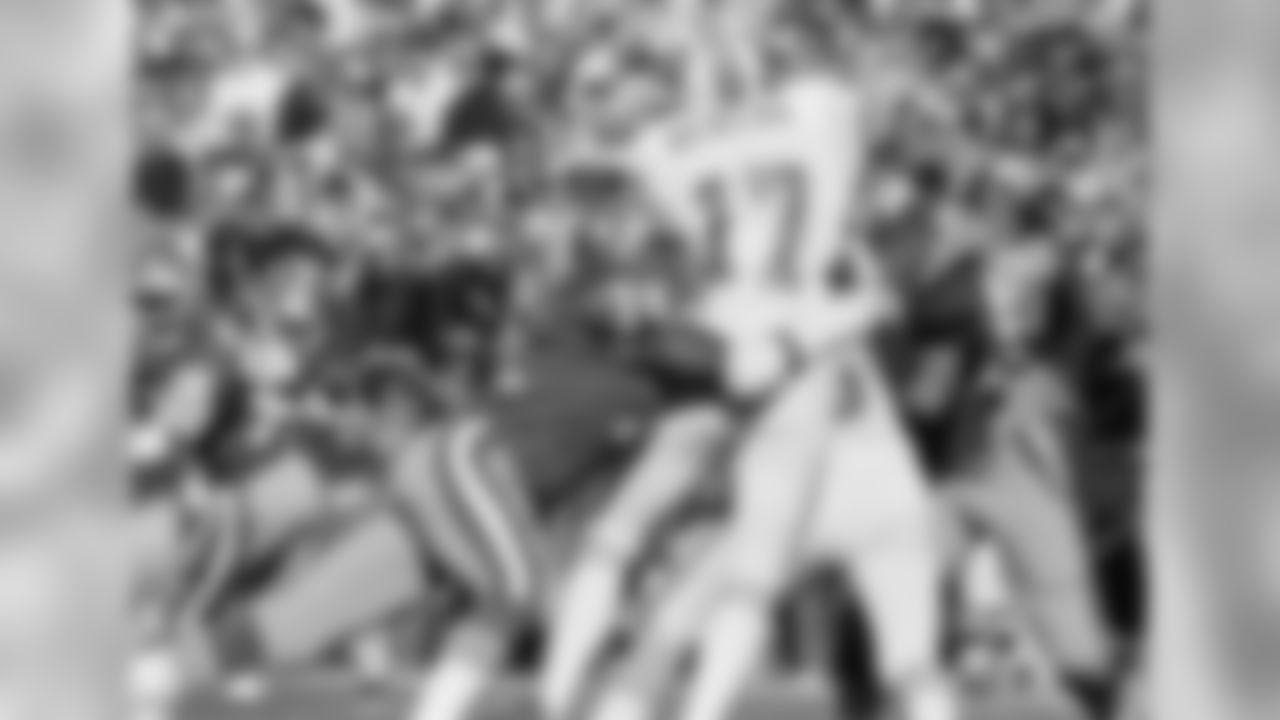 1984 -- Bucs quarterback Steve DeBerg and 49ers pass-rusher Fred Dean.