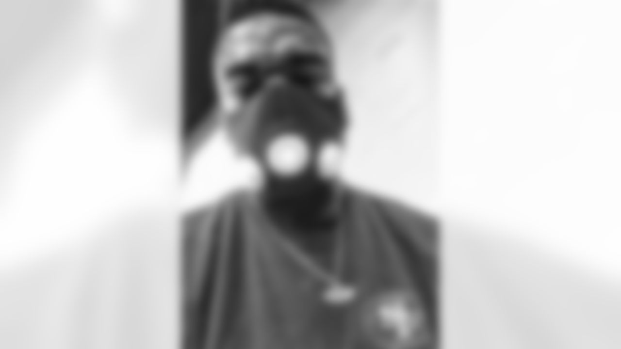 Dontae Johnson wears a training mask during his workout.
