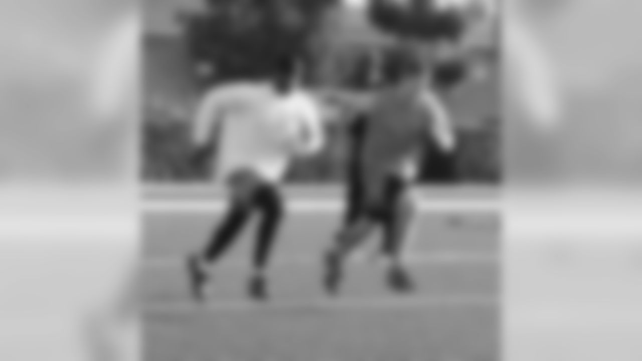 QB Alex Smith and WR Bryant Johnson pace each other