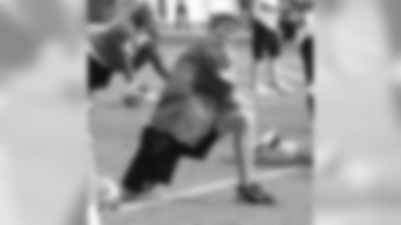 Punter Andy Lee stretches for his first Pro Bowl practice