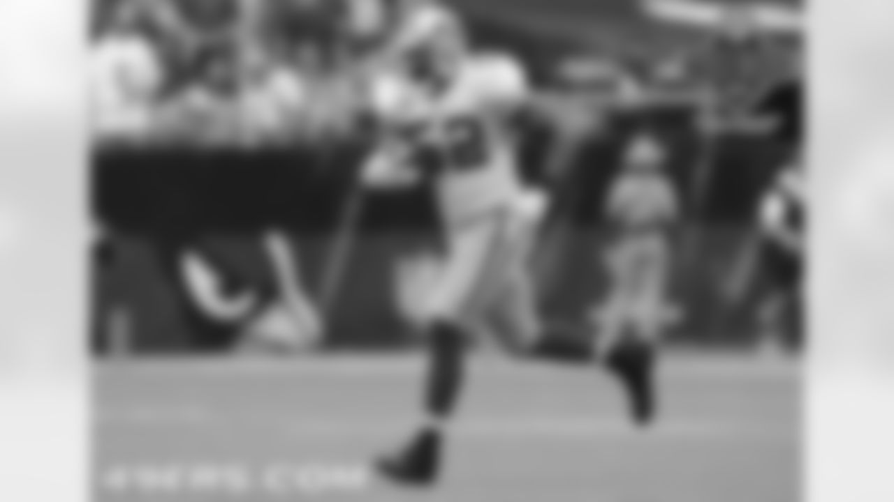 Willis runs off the field after intercepting Kurt Warner.