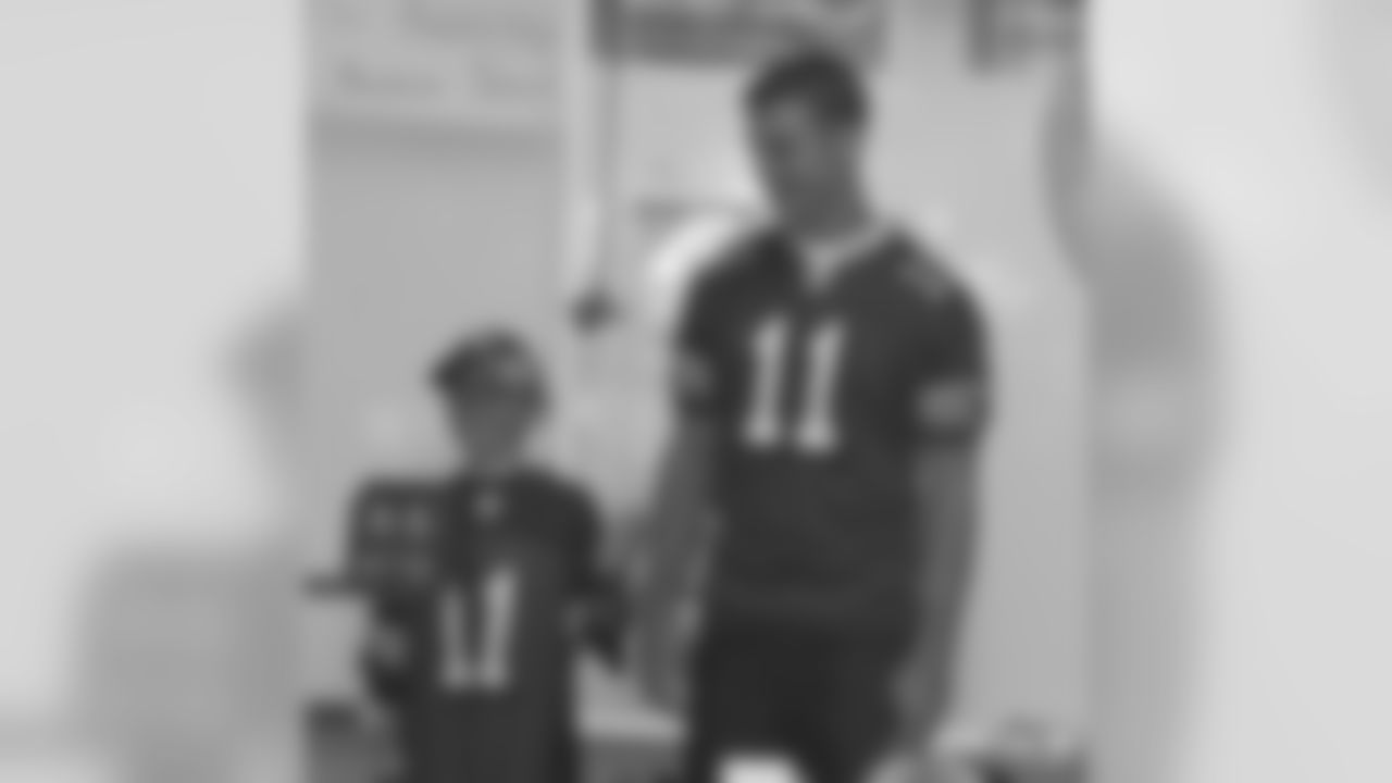 Jordan Macaulay introduces QB Alex Smith to his 4th grade class as part of