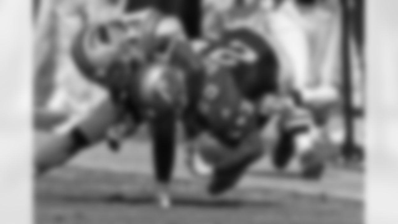 1999 -- 49ers running back Charlie Garner and Panthers defensive back Doug Evans.