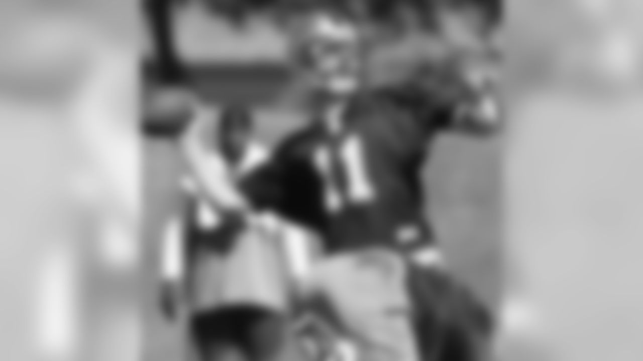 QB Alex Smith throws a pass