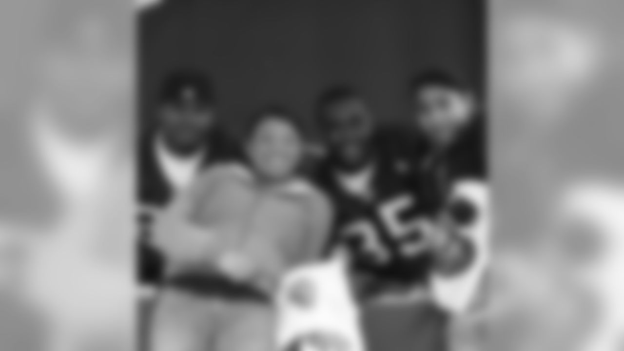 RB Thomas Clayton and CB Tarrel Brown with some fans
