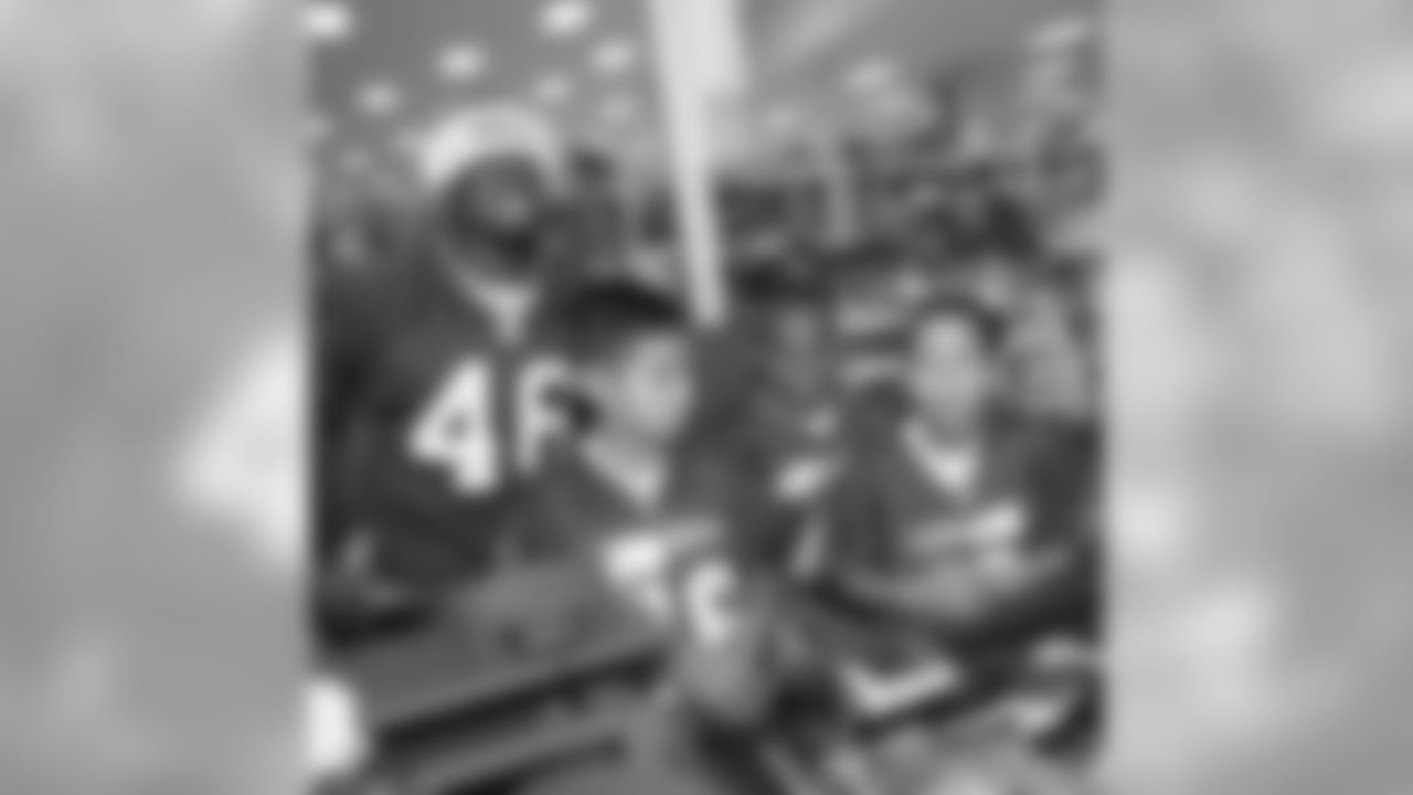 TE Delanie Walker keeps a smile on his face as he goes through the checkout