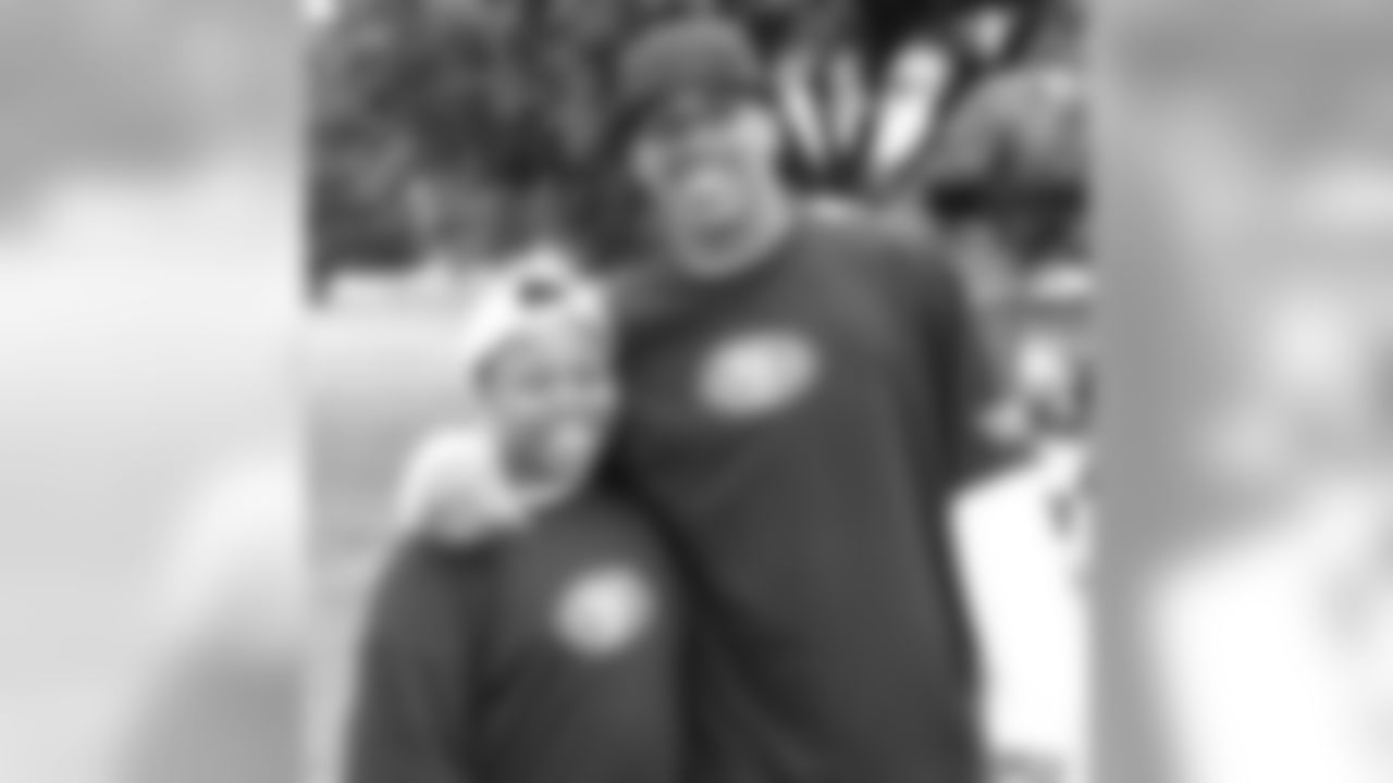WR Arnaz Battle with volunteer at Gilman Park for Hometown Huddle