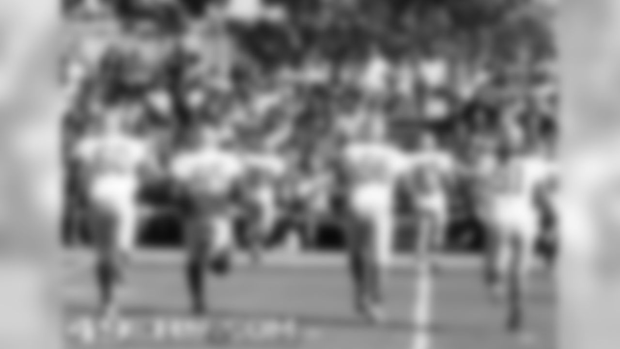 Members of the defense jog towards 49ers Faithful