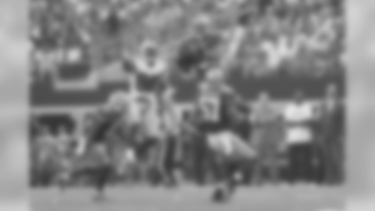 Eric Reid catches a deep Tony Romo pass intended for Dez Bryant and returns the ball 48 yards to Dallas' 2-yard line.