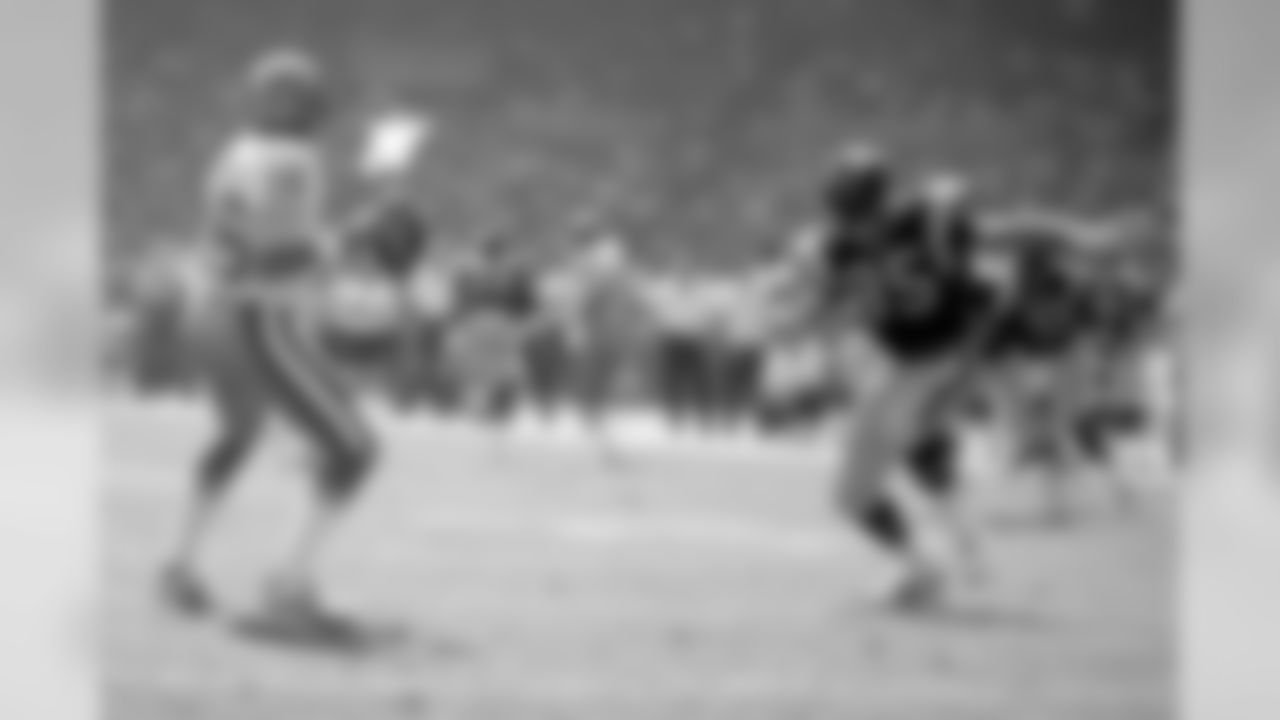 Oct. 23, 1983 -- Rams pass-rusher Jack Youngblood and 49ers quarterback Joe Montana.