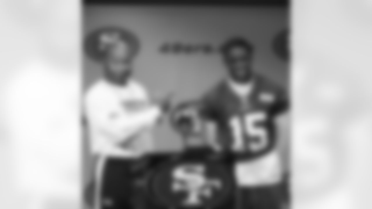 Coach Singletary and Michael Crabtree share a laugh