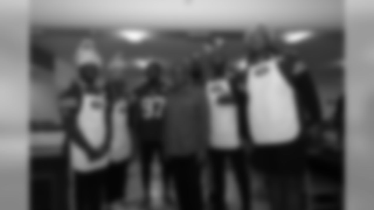 (From left to right) RB Raheem Mostert, QB C.J. Beathard, LB Dekoda Watson, , Director of Men's Rescue and Recovery Programs, DL Leger Douzable, DL DeForest Buckner and OL Trent Brown. 49ers and CityTeam Serve Thanksgiving Dinner