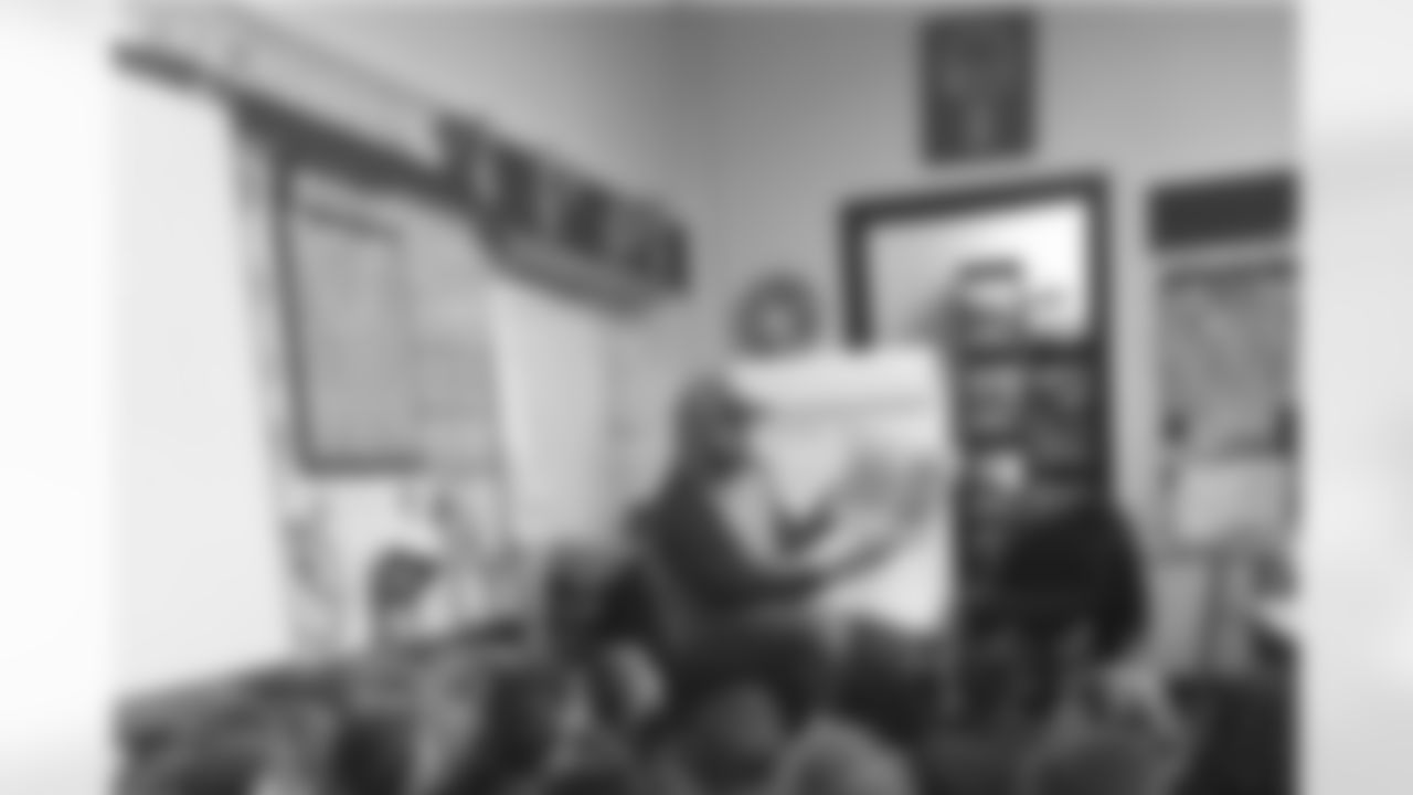 Daniel Kilgore reads to a class of students with the Read Across America initiative.