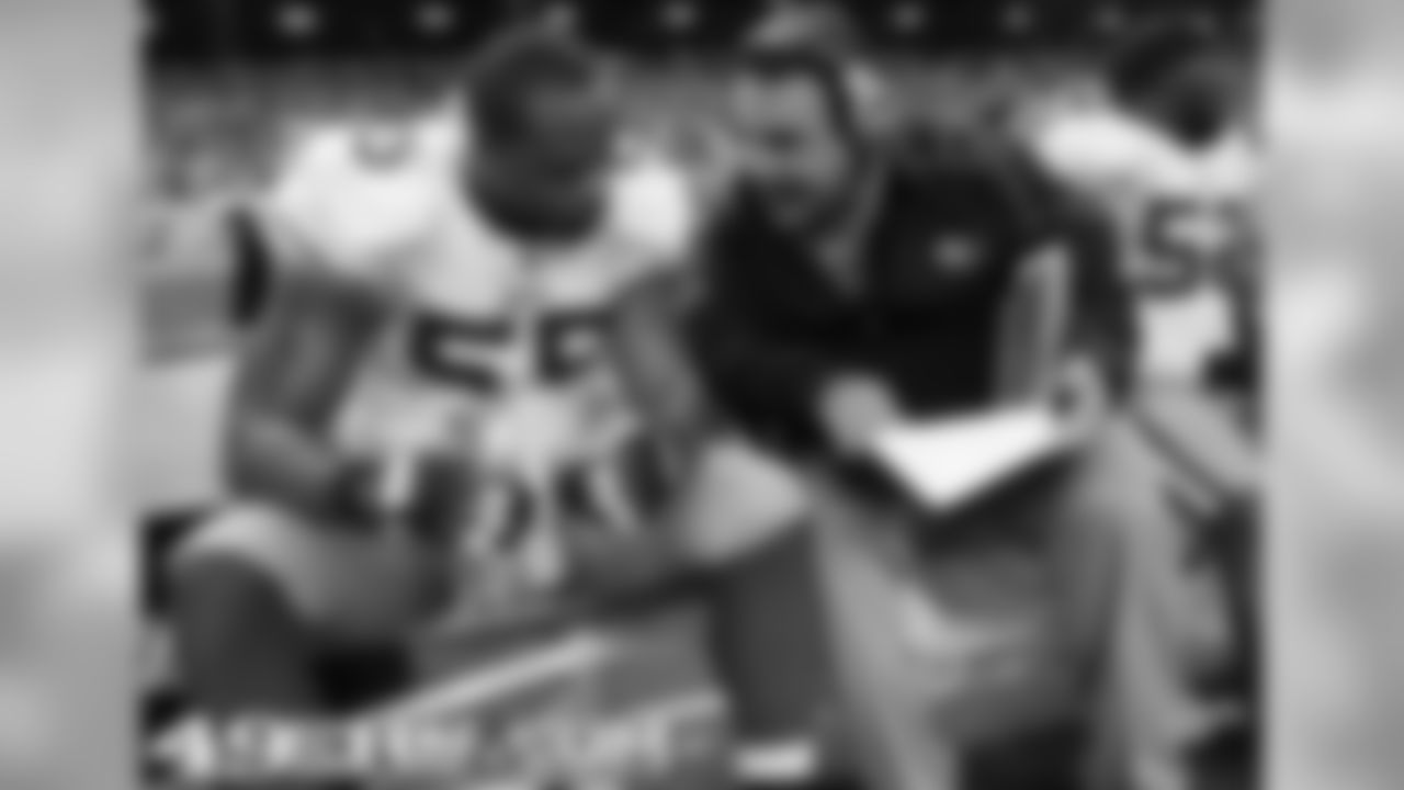 LB Ahmad Brooks with DL coach Jim Tomsula in 2011