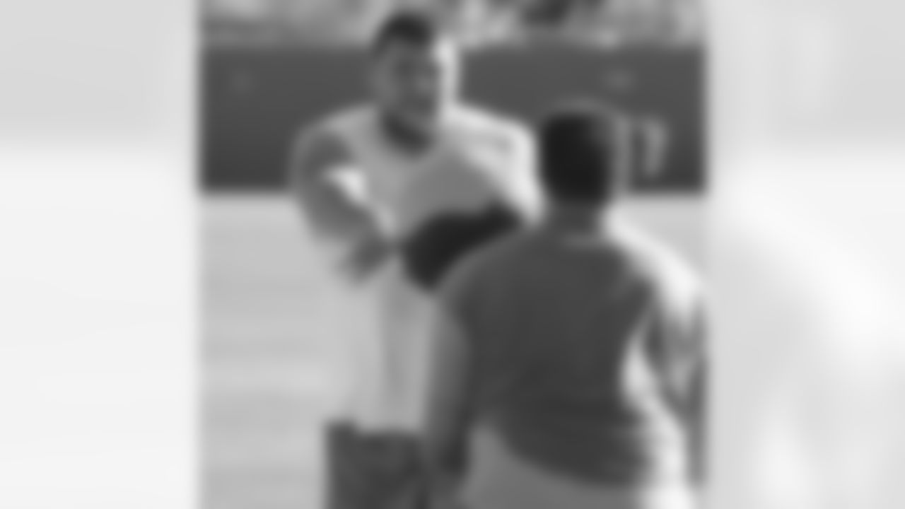 G David Baas tosses a medicine ball at Joe Staley