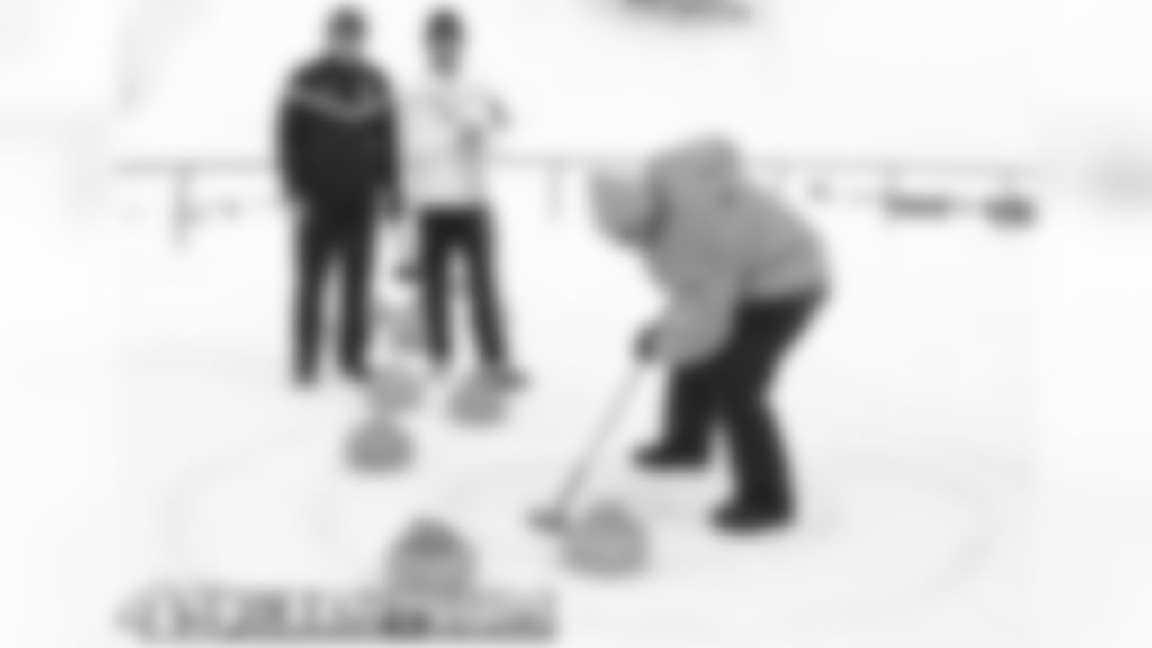 Harbaugh and Baalke had a curling match which raised significant money