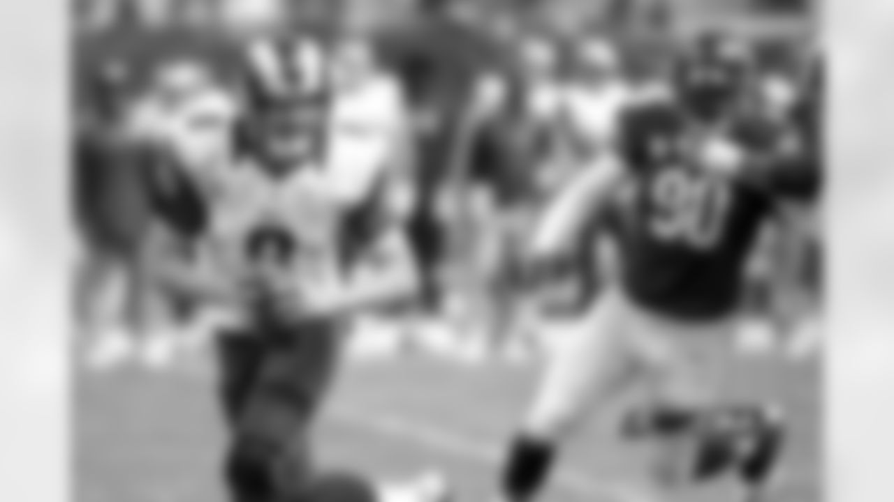 Try as he might, Rams QB Sam Bradford looks to escape the oncoming pressure from Bears DE Julius Peppers.