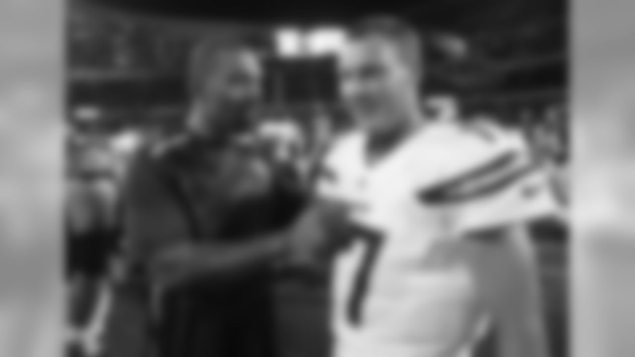 Chicago Bears defensive end Julius Peppers, left, talks to San Diego Chargers quarterback Philip Rivers (17) after the preseason NFL football game, Thursday, Aug. 15, 2013, in Chicago. The Bears won 33-28. (AP Photo/Charles Rex Arbogast)