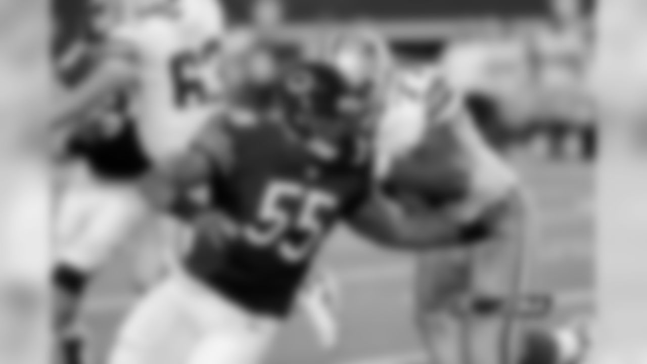 Bears LB Lance Briggs makes his presence felt as he bursts through the Cowboy's offensive line to force another pressure situation.