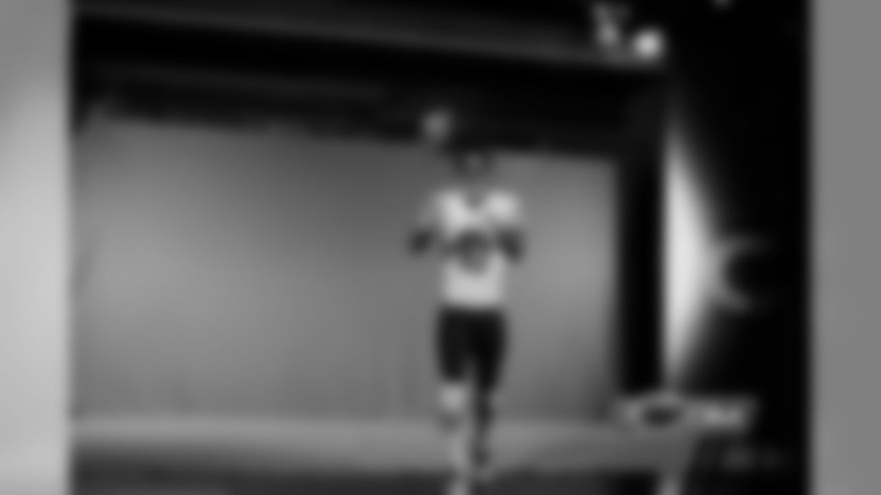 WR Marquess Wilson catches a pass in front of the green screen.