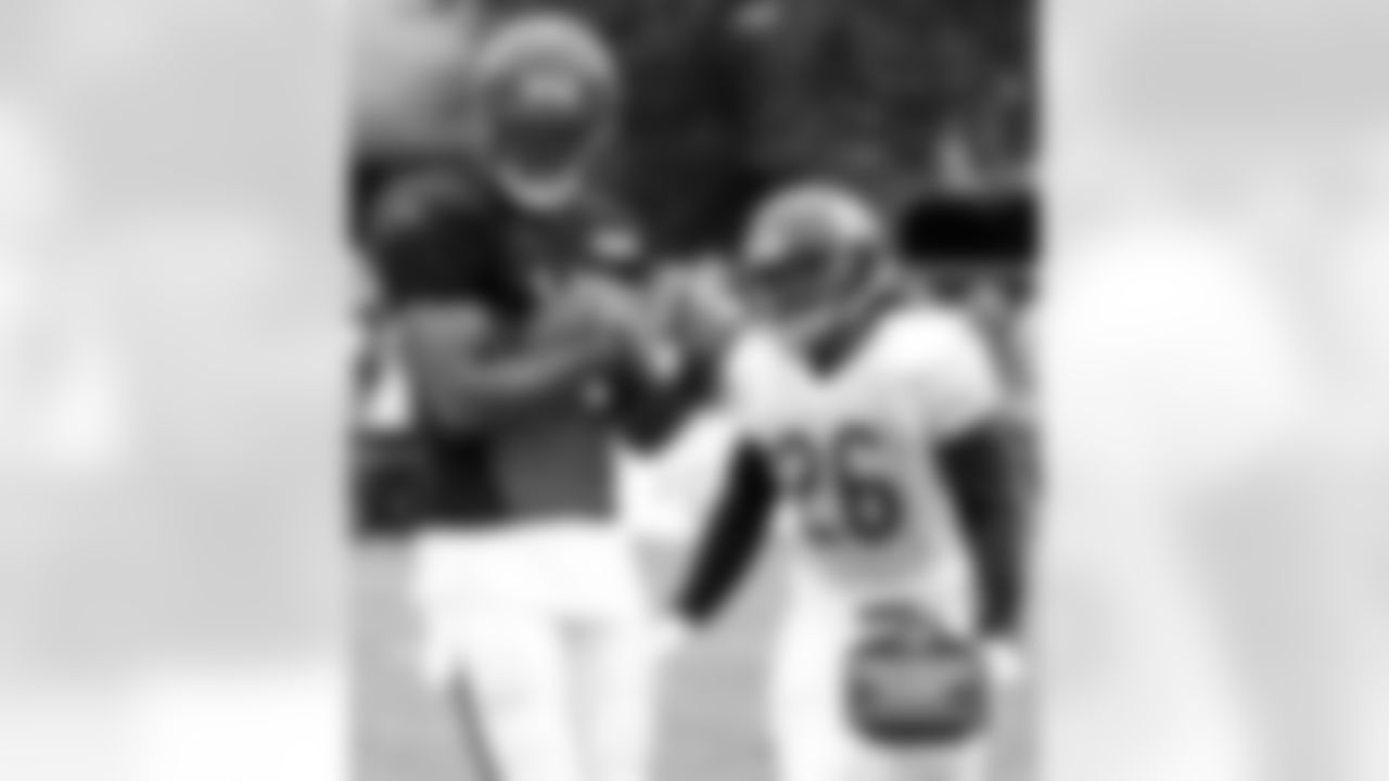 WR Brandon Marshall (left) and CB #26 Tim Jennings